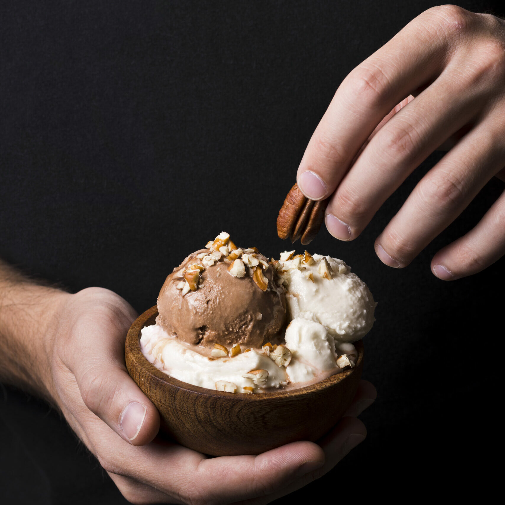 close-up-hands-holding-tasty-gelato-scoops